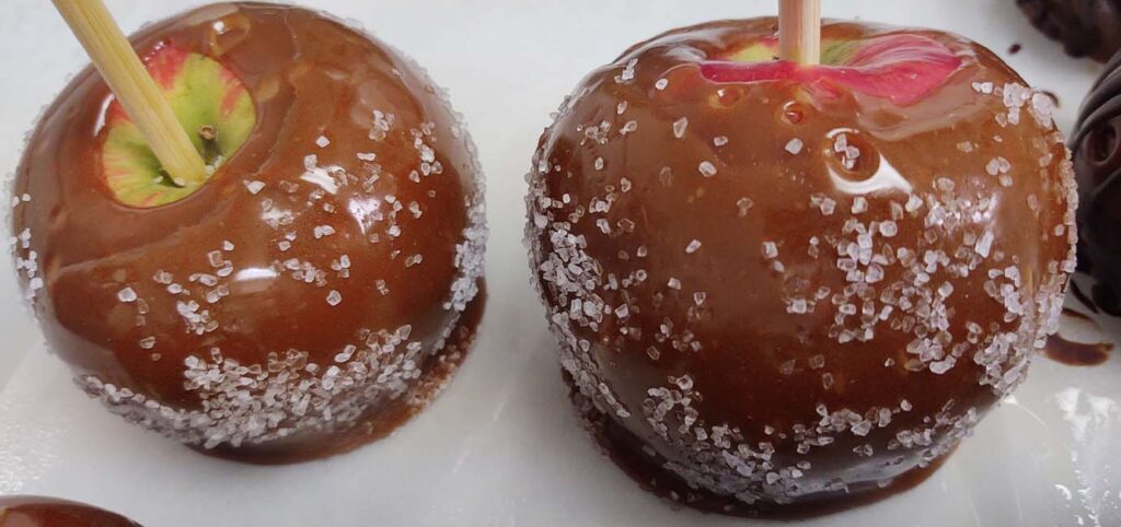 Eat a caramel apple at the apple Barn